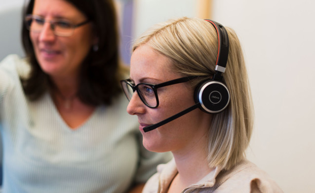 Two women together working in support.