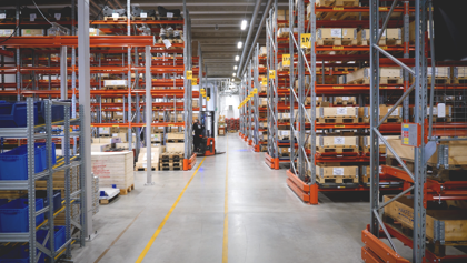 A large warehouse filled with lots of shelves.