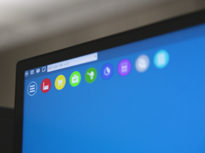 A close up of a computer screen with a blue background displaying Monitor ERP.