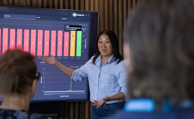 Woman presenting information on a graph