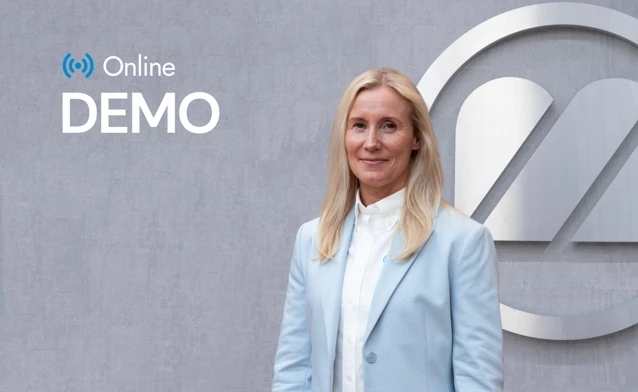 A woman standing in front of a wall.