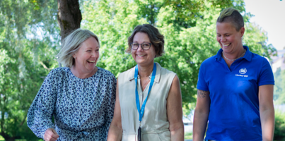 Three employees at Monitor taking a walk outside