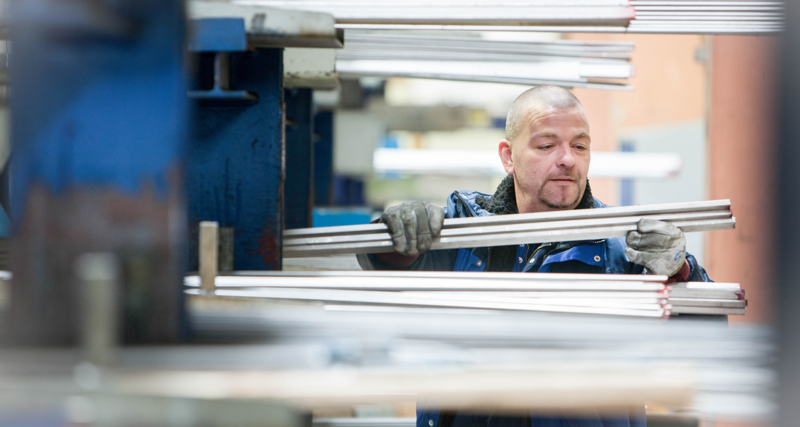 A person standing in a factory.