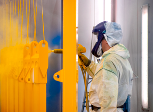 A person powder coating