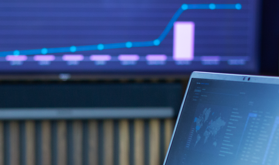 laptop on a table showing Monitor ERP Dashboard