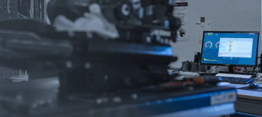A computer monitor sitting on top of a desk.