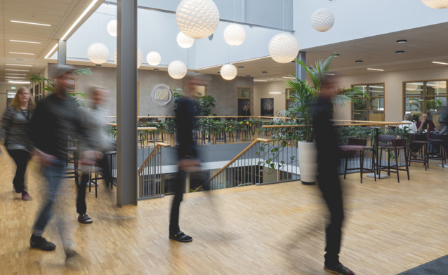 People working in a large office.