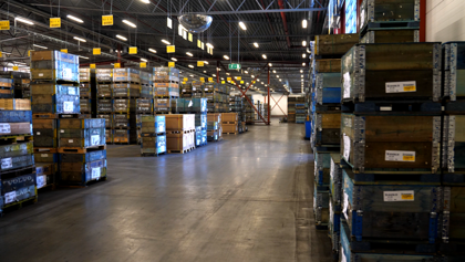 A large warehouse filled with lots of boxes.