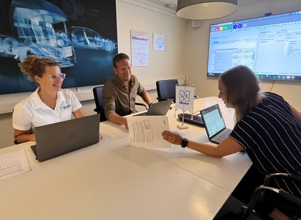 People around a table at a meeting