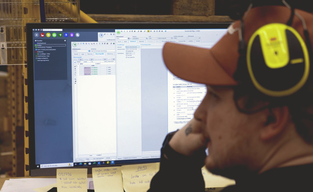 Man in front of a computer.